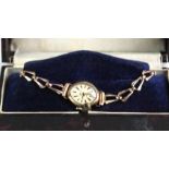 Ladies 9ct cased Carronade wristwatch on a 9ct bracelet. Total weight 10.4g in its original? Box