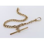 9ct yellow gold hollow curb link bracelet with swivel clasp and T bar suspended, length 19cm, weight