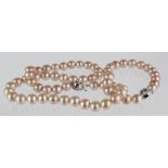 Set of pink freshwater pearl jewellery, necklace and bracelet with silve rose clasp, weight 67.7g