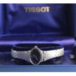 Ladies stainless steel cased Tissot wristwatch, The blue oval dial with white baton markers, on a