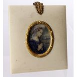 Portrait Minature. An exquisite portrait miniature depicting a young girl in a blue dress, circa