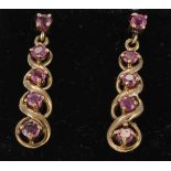 9ct yellow gold twist design drop earrings set with graduated rubies, weight 2.6g