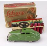 Schuco 3000 green telesteering car, with instructions and accessories (key missing), contained in