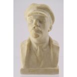 Parian ware portrait bust of Lenin wearing cap. Height measures approx 17cm.