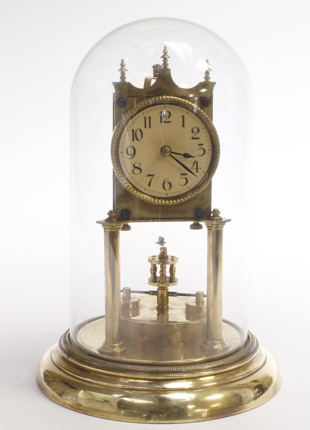 Brass anniversary clock, beneath a glass dome, total height 28cm approx.