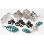 Four sets of matching silver jewellery, two ring and pendant sets and two pendant and earring
