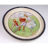 Early decorated china golf plate, reads on the front "The Indispensable Caddie", no maker's mark,