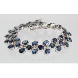14ct white gold bracelet set with sapphire and diamond in three row design with hidden box clasp and