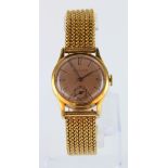 Mid-size 18ct cased Jaeger-LeCoultre Fabrique En Suisse wristwatch (circa 1950s). On an 18ct gold