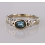 9ct white gold ring set with single oval blue topaz, finger size J, weight 2.1g