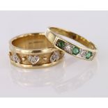 Two rings to include a 9ct yellow gold emerald and diamond channel set five stone half eternity