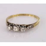 Yellow metal marked 18ct and Plat. three stone Diamond Ring size P weight 2.2g