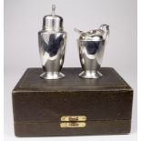 Silver milk jug & sugar sifter, hallmarked 'CSG&Co., Birmingham 1939 / 1940', contained in fitted