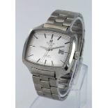 Gents Tissot "Seven" automaic wristwatch. The oblong silver dial with silvered baton markers and