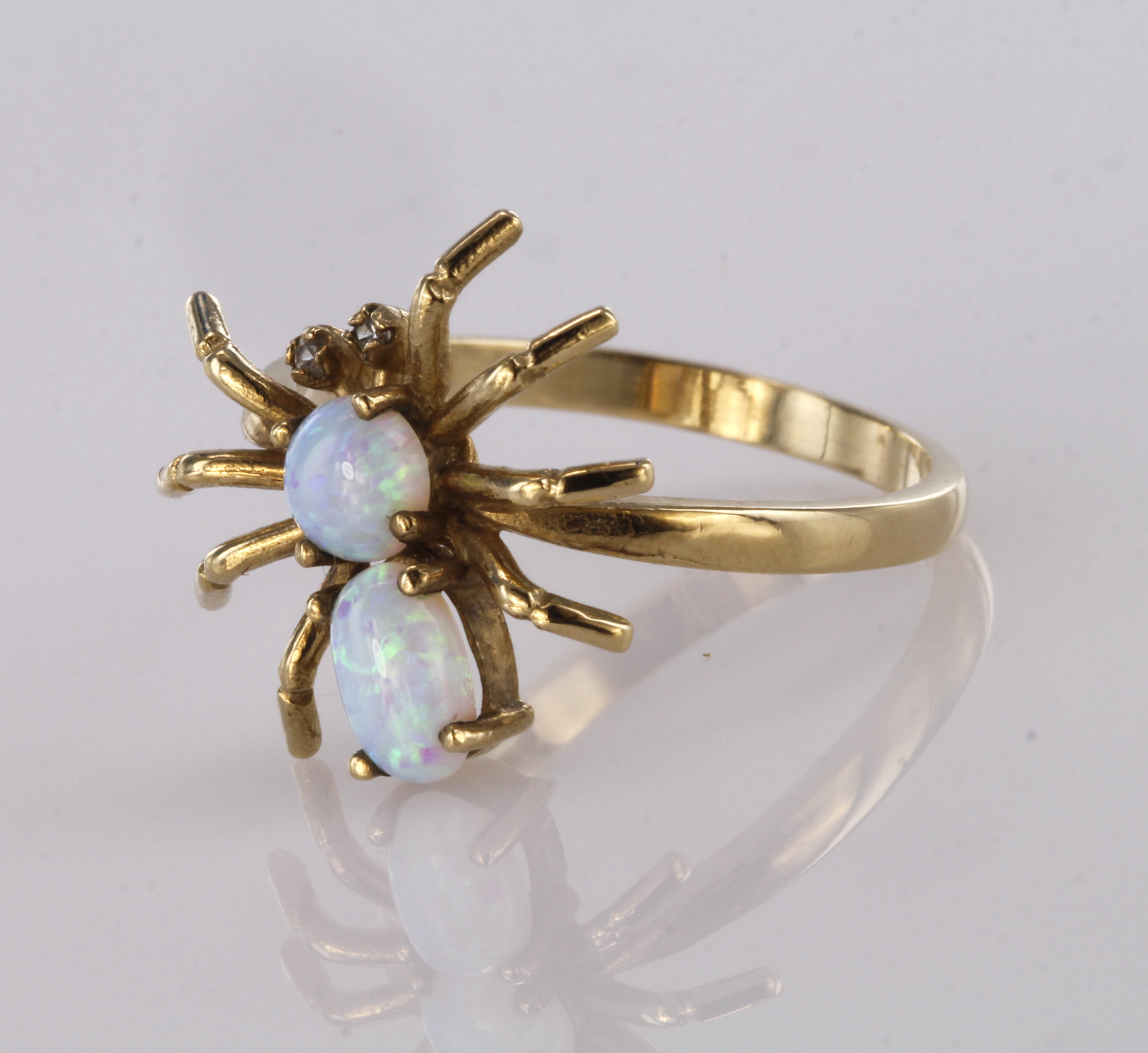 9ct yellow gold spider ring set with two opal cabochon stones and diamond eyes, finger size O,