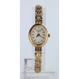 Ladies 9ct yellow gold WHW bracelet wrist watch with mother of pearl dial and spare links, weight