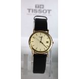 Tissot Gents 18ct Gold cased wristwatch, on a Tissot leather strap, case diameter 33mm approx., with