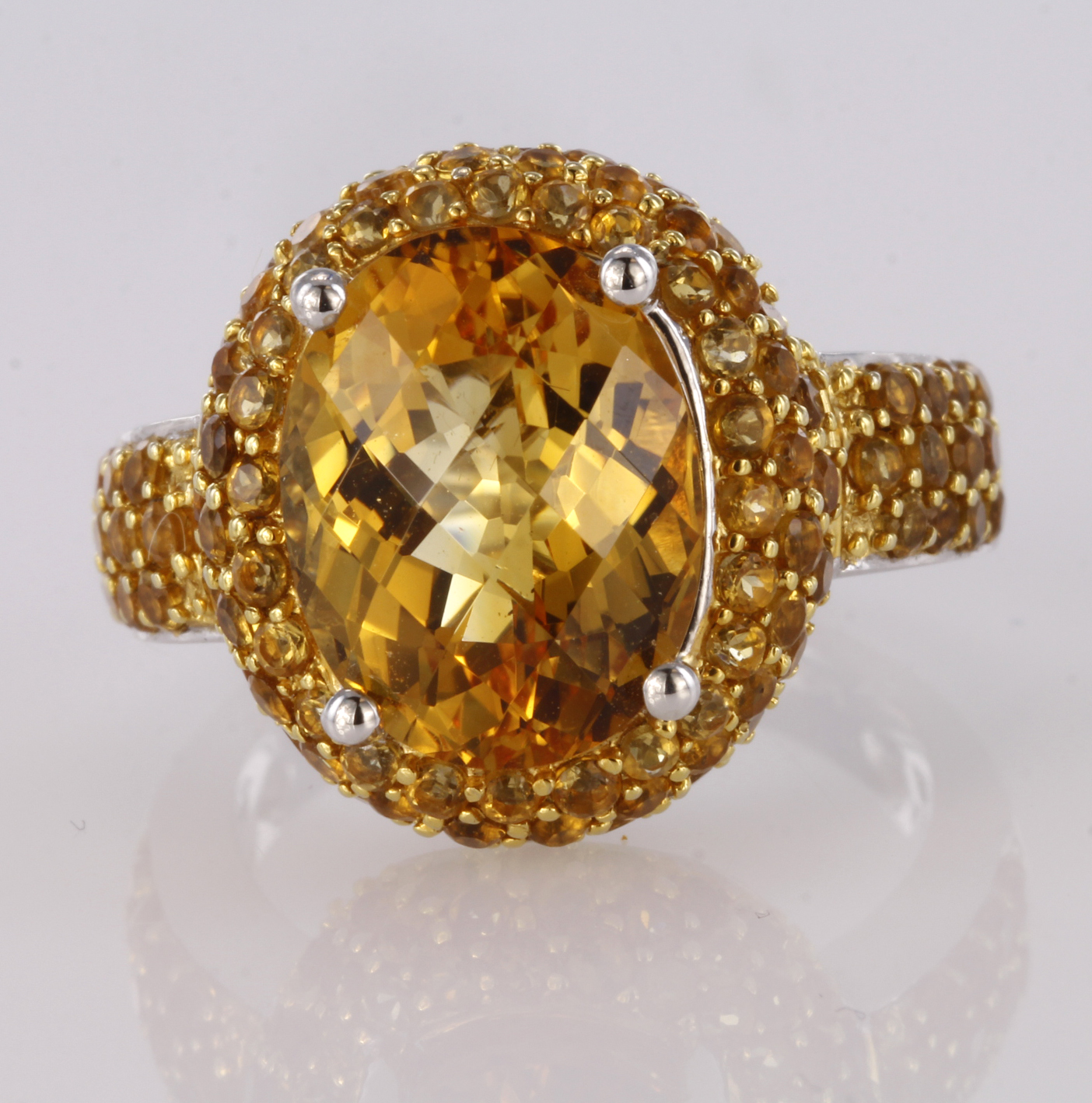 18ct white gold dress ring set with central oval chequerboard cut citrine, surrounded by pave set