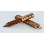 9ct cased pencil holder complete with pencil. Hallmarked Birmingham 1902 by William Vale & Sons