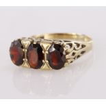 9ct Gold Garnet set three stone Ring size O weight 3.2g