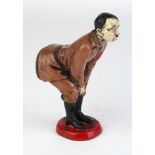 Novelty Adolf Hitler cold painted pin cushion, modelled bent-over with his cloth-covered rear end