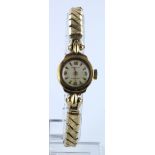 Ladies Ingersol 9ct gold cased mechanical watch on expanding gold plated strap, working when