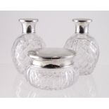 Three silver topped cut glass scent bottles & jar, hallmarked 'Mappin & Webb, London 1945',