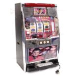 Fruit Machine. A Japanese Elvis Presley fruit machine, with key & a collection of tokens, height