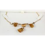 15ct yellow gold citrine necklace set with five rectangular graduated stones on a fine chain, weight