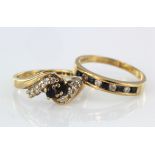 Two 9ct yellow gold rings to include a sapphire and diamond set crossover style ring, finger size H,