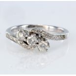 18ct white gold diamond three stone crossover design ring with diamond set shoulders, approx.