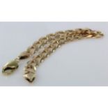 Yellow metal (stamped 375) flat curb bracelet. Approx length 8.5", weight 24.8g