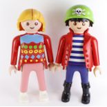 Playmobil. Two large plastic Playmobil figures (possibly used as shop displays), one depicting a pir