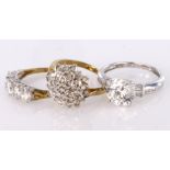 Three rings to include a 14ct white gold cz set solitaire ring, an 9ct yellow gold cz cluster ring