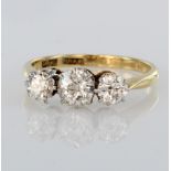 18ct yellow gold trilogy ring set with three graduated round old cut diamonds in platinum mount,