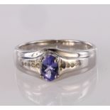 9ct white gold band ring set with oval tanzanite and diamond accents, finger size U, weight 4.1g