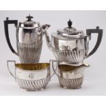 Edwardian silver water jug and three piece tea/coffee set. Hallmarked Sheffield 1902 (Teapot 1897)