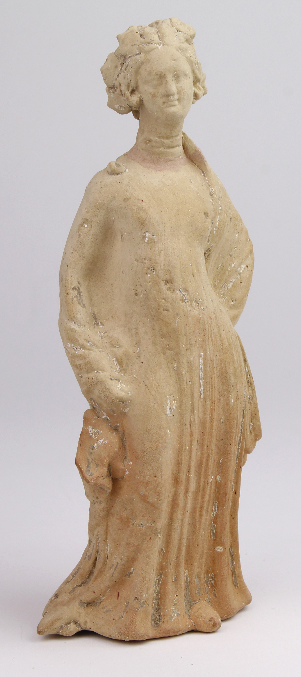 Statue. An early Greek terracotta female statue, circa 4th - 1st Century B.C., repaired at neck,