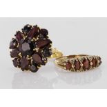 Two 9ct yellow gold garnet rings, to include a five stone graduated ring and a large cluster dress