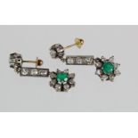 18ct white gold drop earrings set with emeralds and diamonds with screw post and butterfly fittings.