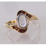 9ct yellow gold moonstone and ruby crossover design ring, finger size M, weight 3.7g