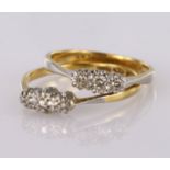 Two 18ct and platinum diamond set three stone rings, weight 3.7g