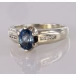 9ct white gold ring set with oval blue topaz and diamond accents, finger size N, weight 4.5g