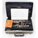Bundy three piece ebonite oboe, contained in a fitted case
