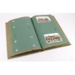 Tall old green album of old postcards including Southend, Clacton, Gt Yarmouth, etc etc. (approx
