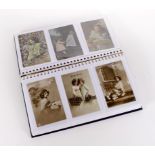 Children, varied selection in blue album, black & white and coloured   (approx 142 cards)