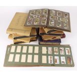 Large yellow crate with ten vintage albums of Cigarette Cards, mostly in full sets, Cricketers by