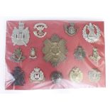 Cap badges - red card of Queen Victorian Cap badges + 1x large button. With K&K numbers. (14 items)