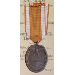 German West Wall medal in packet with award document Dem Einschaler Willy Schneider Aus Northeim