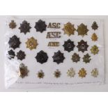 Cap badges / collars / titles inc ASC, RASC, RCT. (27 items)